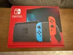 Brand New Nintendo Switch Handheld Console - Red/neon Blue. Price: $229.00.