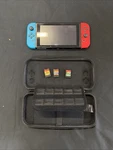 Nintendo Switch 32GB Console With Neon Red And Blue Joy-con, Case & Games Used. Price: $149.99.
