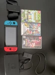 Nintendo Switch Console W/ Dock, Charger, Pikmin 3, Smash Bros, Pok Mon Used. Price: $189.00.