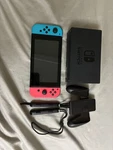 Nintendo Switch 32GB With Joycons Controllers Wriststraps And Dock Used. Price: $230.00.