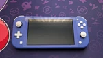 Nintendo Switch Lite Blue Handheld System HDH-001 Usb-c Headphone Jack Used. Price: $120.00.