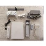 Nintendo Wii Console With Remote, Nunchuk, Sensor Bar, Sandisk 128GB Sd Card Used. Price: $75.00.