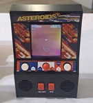 Asteroids Handheld Classic Mini Arcade Game By Basic Fun #09542 Tested Used. Price: $14.00.