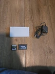 Nintendo Ds Lite Console With Charger And Games - Polar White Used. Price: $65.00.