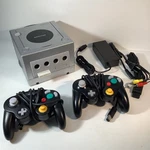 Nintendo Gamecube DOL-101 Platinum Console Cables, Controllers, & Mem Card Used. Price: $124.99.
