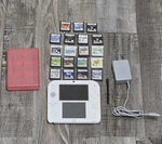 Nintendo 2DS Console Red/white With Charger, Stylus, Case, 19 Games Used. Price: $200.00.