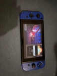 Nintendo Switch Unpatched, Low Serial, With Joy Cons And 64GB Memory Card Used. Price: $250.00.