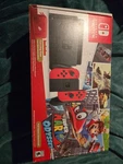 Nintendo Switch Super Mario Odyssey Edition 32GB Red Console And Games Used. Price: $300.00.