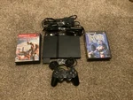 Sony Playstation 2 Slim Bundle Complete With Games, Memory Card, And Cables Used. Price: $150.00.